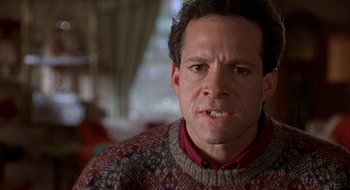 Movie still from “Home for the Holidays” (1995), directed by Jodie Foster – A person wearing a sweater; Close Up shot, Low angle