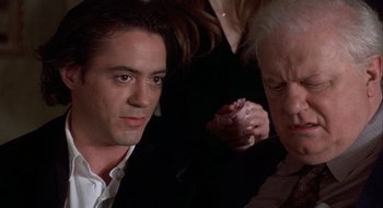 Movie still from “Home for the Holidays” (1995), directed by Jodie Foster – A man and a woman looking at each other in a dark room; Close Up shot, Over the shoulder angle