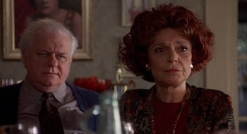 Movie still from “Home for the Holidays” (1995), directed by Jodie Foster – An older man and woman sitting at a dinner table; Close Up shot, Over the shoulder angle