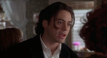 Movie still from “Home for the Holidays” (1995), directed by Jodie Foster – A person with long hair; Close Up shot, Over the shoulder angle