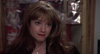 Movie still from “Home for the Holidays” (1995), directed by Jodie Foster – A person with long brown hair; Close Up shot, Over the shoulder angle
