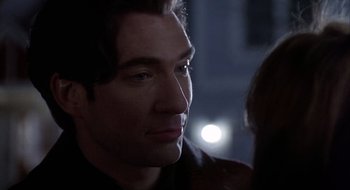 Movie still from “Home for the Holidays” (1995), directed by Jodie Foster – A man's face in the dark; Close Up shot, Over the shoulder angle