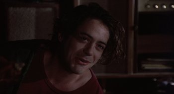 Movie still from “Home for the Holidays” (1995), directed by Jodie Foster – A person with long hair; Close Up shot, Over the shoulder angle