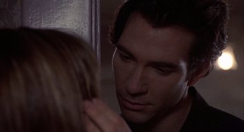 Movie still from “Home for the Holidays” (1995), directed by Jodie Foster – A person touching a woman's face; Close Up shot, Over the shoulder angle