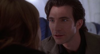 Movie still from “Home for the Holidays” (1995), directed by Jodie Foster – A person looking at another person; Close Up shot, Over the shoulder angle