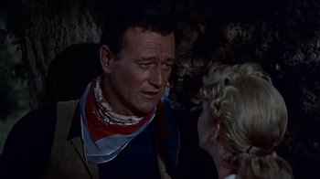 Movie still from “Hondo” (1953), directed by John Farrow – A man and a woman talking to each other; Close Up shot, Over the shoulder angle