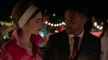 Movie still from “Emily in Paris” (2020), created by Darren Star – A man and a woman are talking to each other; Close Up shot, Over the shoulder angle