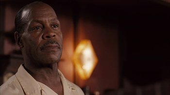 Movie still from “Honeydripper” (2007), directed by John Sayles – An older man is looking at the camera; Close Up shot, Low angle