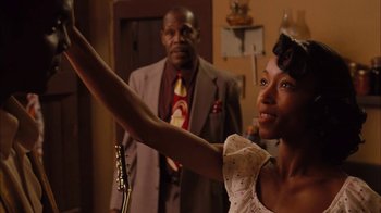 Movie still from “Honeydripper” (2007), directed by John Sayles – A man and a woman standing next to each other; Medium shot, Over the shoulder angle