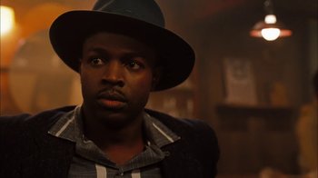 Movie still from “Honeydripper” (2007), directed by John Sayles – A person wearing a hat; Close Up shot, Low angle