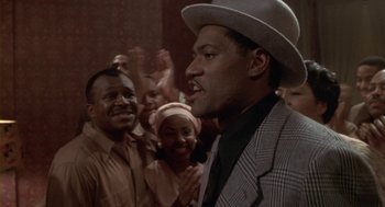 Movie still from “Hoodlum” (1997), directed by Bill Duke – A group of people standing in a room; Close Up shot, Low angle