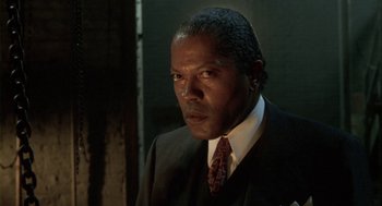 Movie still from “Hoodlum” (1997), directed by Bill Duke – A man in a suit and a tie; Close Up shot, Low angle