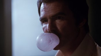 Movie still from “Hooper” (1978), directed by Hal Needham – A person blowing a bubble with gum; Close Up shot, Low angle
