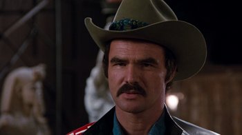 Movie still from “Hooper” (1978), directed by Hal Needham – A person wearing a cowboy hat; Close Up shot, Over the shoulder angle