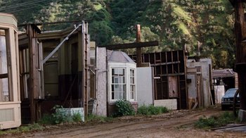 Movie still from “Hooper” (1978), directed by Hal Needham – An old house with a lot of windows and a wooden structure; Extreme Wide shot, High angle
