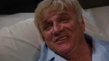 Movie still from “Hooper” (1978), directed by Hal Needham – A person with white hair; Close Up shot, Low angle