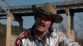 Movie still from “Hooper” (1978), directed by Hal Needham – A man in a cowboy hat and a silver jacket; Close Up shot, Low angle
