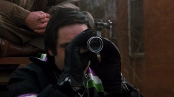 A man taking a picture with a camera