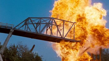 Movie still from “Hooper” (1978), directed by Hal Needham – A bridge that is falling down into the ground; Extreme Wide shot, Low angle
