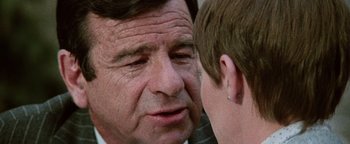 Movie still from “Hopscotch” (1980), directed by Ronald Neame – An older man talking to a young man; Close Up shot, Over the shoulder angle