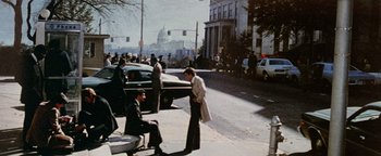 Movie still from “Hopscotch” (1980), directed by Ronald Neame – A man and a woman standing on the side of a road; Extreme Wide shot, High angle