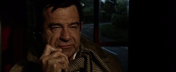 Movie still from “Hopscotch” (1980), directed by Ronald Neame – A person sitting on a bus; Close Up shot, High angle