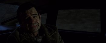 Movie still from “Hopscotch” (1980), directed by Ronald Neame – An older man sitting in a car at night; Close Up shot, Over the shoulder angle