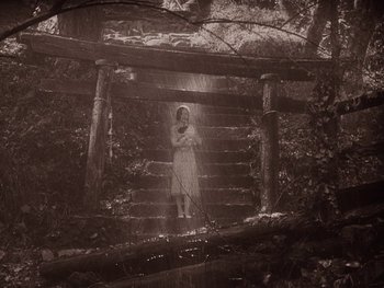 Movie still from “House” (1977), directed by Nobuhiko Ôbayashi – A woman standing on top of a set of stairs; Wide shot, High angle