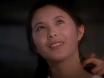 Movie still from “House” (1977), directed by Nobuhiko Ôbayashi – A beautiful young lady looking up at the sky; Close Up shot, Low angle