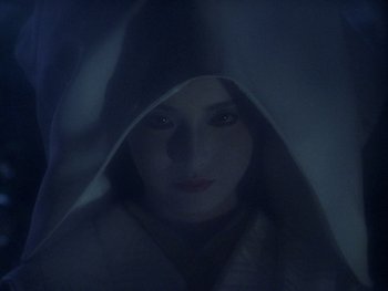 Movie still from “House” (1977), directed by Nobuhiko Ôbayashi – A woman with a hood over her head; Close Up shot, Low angle