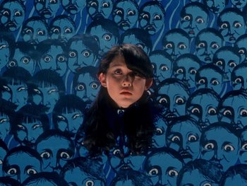 Movie still from “House” (1977), directed by Nobuhiko Ôbayashi – A girl is surrounded by many faces of people; Close Up shot, Overhead angle