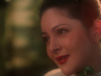 Movie still from “House” (1977), directed by Nobuhiko Ôbayashi – A woman's face with red lipstick; Close Up shot, Over the shoulder angle
