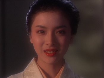 Movie still from “House” (1977), directed by Nobuhiko Ôbayashi – A person wearing a white shirt; Close Up shot, Low angle