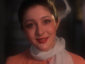 Movie still from “House” (1977), directed by Nobuhiko Ôbayashi – A person wearing a neck scarf; Close Up shot, High angle