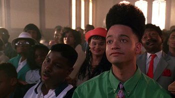 Movie still from “House Party 2” (1991), directed by Doug McHenry – A group of young men sitting in a room; Close Up shot, Low angle