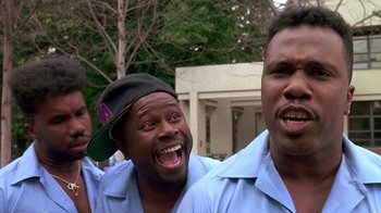 Movie still from “House Party 2” (1991), directed by Doug McHenry – A group of men standing next to each other; Close Up shot, Low angle