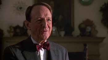Movie still from “House Party 2” (1991), directed by Doug McHenry – An older man wearing a suit and a bow tie; Close Up shot, Low angle