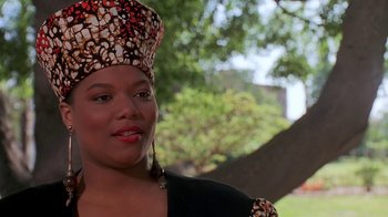 Movie still from “House Party 2” (1991), directed by Doug McHenry – A person wearing a head scarf; Close Up shot, Low angle