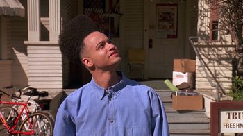 Movie still from “House Party 2” (1991), directed by Doug McHenry – A young man with an afro is standing outside; Close Up shot, Low angle