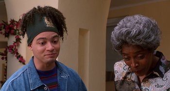 Movie still from “House Party 3” (1994), directed by Eric Meza – A man and a woman standing next to each other; Close Up shot, Over the shoulder angle