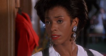 Movie still from “House Party 3” (1994), directed by Eric Meza – A person wearing a white shirt; Close Up shot, Over the shoulder angle