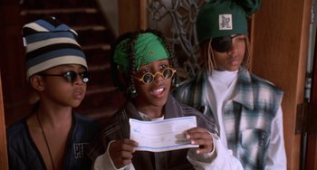 Movie still from “House Party 3” (1994), directed by Eric Meza – A group of young people sitting next to each other; Close Up shot, Low angle