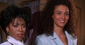 Movie still from “House Party 3” (1994), directed by Eric Meza – Two women standing next to each other in a room; Close Up shot, Over the shoulder angle
