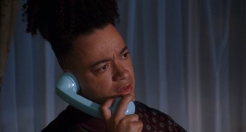 Movie still from “House Party 3” (1994), directed by Eric Meza – A man holding a phone up to his ear; Close Up shot, Low angle