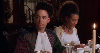 Movie still from “House Party 3” (1994), directed by Eric Meza – A man and a woman sitting at a dinner table; Close Up shot, High angle