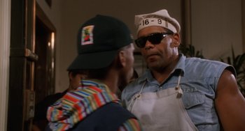 Movie still from “House Party 3” (1994), directed by Eric Meza – Two men are talking to each other in a kitchen; Close Up shot, Low angle