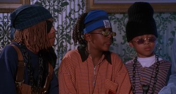 Movie still from “House Party 3” (1994), directed by Eric Meza – A group of people sitting next to each other; Close Up shot, Low angle