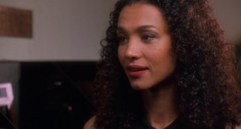 Movie still from “House Party 3” (1994), directed by Eric Meza – A person with curly hair; Close Up shot, Over the shoulder angle