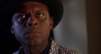 Movie still from “House Party 3” (1994), directed by Eric Meza – A person wearing a hat; Close Up shot, Low angle