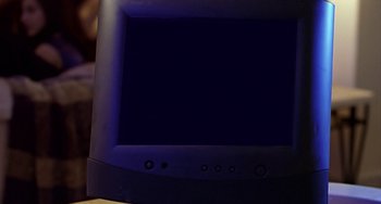 Movie still from “House Party 4: Down to the Last Minute” (2001), directed by Chris Stokes – View of a television screen with a dark background; Extreme Close Up shot, High angle